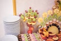 Candy bar.Different delicious fruits on wedding reception table with bananas and grapes Royalty Free Stock Photo