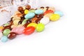 Candy beans with glass jar on white