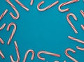 Candy Cane Background on a Blue Background Royalty Free Stock Photo