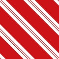 Candy cane Christmas seamless vector pattern. Traditional red white striped background. Elegant diagonal stripes Royalty Free Stock Photo