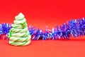 A candy cane Christmas tree displayed with blue tinsel Royalty Free Stock Photo