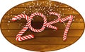 2021 in candy cane design on wooden plaque Royalty Free Stock Photo