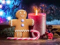 Candy Cane, Gingerbread Man And Burning Candle As The Symbols Of Christmas Happiness And Miracle