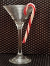 Candy cane hanging in a martini glass Royalty Free Stock Photo