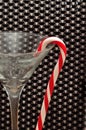 Candy cane hanging in a martini glass Royalty Free Stock Photo