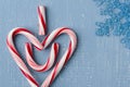 Candy Cane Heart Symbol on Blue Wood with Snowflake Upper Right Side Royalty Free Stock Photo