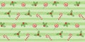 Festive seamless pattern with traditional sweet treats, mistletoe and Christmas Holly berries on a light green striped background