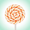 Orange and white striped lollipop, Candy cane sweet spiral Royalty Free Stock Photo