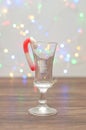 A candy cane used as a decoration in a shooter glass Royalty Free Stock Photo