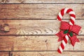 Candy Cane On A Weathered Wood Background