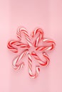 Candy canes arranged in flower shape.