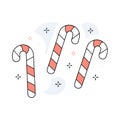 Candy canes arranged on a light blue background Royalty Free Stock Photo