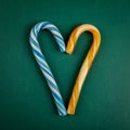Candy canes on a green chalkboard. Christmas and holidays concept