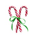 Candy canes with green Ribbon isolated on a white background Royalty Free Stock Photo