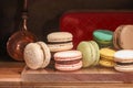 candy colored macaroons on a wooden shelf Royalty Free Stock Photo