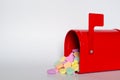 Candy conversation hearts spilling out of a red mailbox Royalty Free Stock Photo