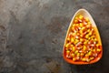 Candy corn in a bowl Halloween background
