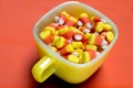 Candy corn filled coffee cup Royalty Free Stock Photo