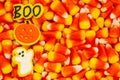 Candy corn, ghost, pumpkin, and boo Halloween background