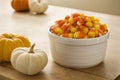 Bowl of Candy Corn with Mini Pumpkins Royalty Free Stock Photo