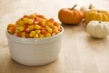 Bowl of Candy Corn with Mini Pumpkins Royalty Free Stock Photo
