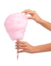 Candy floss, sweet and woman hands isolated on a white background for eating, pink food and holiday treat. Person hand Royalty Free Stock Photo