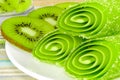 Candy fruit with slices kiwi on a plate Royalty Free Stock Photo