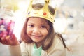 Candy, girl or princess with crown in portrait, home or castle with queen costume, sweets or royal tiara. Play Royalty Free Stock Photo