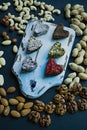 Candy handmade. Sweets without sugar from dried fruits and nuts. Proper nutrition. An assortment of nuts. View from above