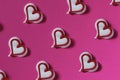 Candy heart white on a pink paper background. Creative conc Royalty Free Stock Photo