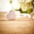 Candy Heart on Wood Table with White Rose Bouquet Royalty Free Stock Photo