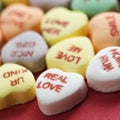 Candy hearts on red. Royalty Free Stock Photo