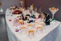 Candy jar and drinks on a dessert table at party or wedding celebration Royalty Free Stock Photo