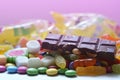 Candy, lollipop, colored smarties, chocolate and gummy bears background Royalty Free Stock Photo