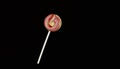 Candy lollipop macro photo, desert ideas on dark black isolated background