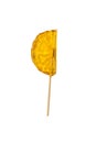 Candy lollipop in the shape of an orange slice isolated on a white background Royalty Free Stock Photo