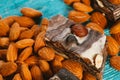 Candy paste and almonds on blue wooden background