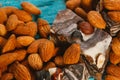 Candy paste and almonds on blue wooden background