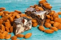 Candy paste and almonds on blue wooden background