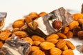 Candy paste and almonds on white wooden background