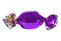 Candy in purple foil isolated. Candy wrapped in a label. Christmas