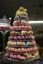 Candy shop display with colorful pyramid of French macarons biscuits Royalty Free Stock Photo