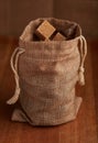 Cane brown sugar cubes in a burlap sack Royalty Free Stock Photo