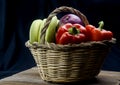 Cane and esparto basket with fruits and vegetables