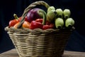 Cane and esparto basket with fruits and vegetables