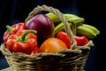 Cane and esparto basket with fruits and vegetables