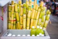 Cane and fresh sugarcane juice in bottle