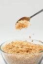 Cane sugar falling from a tea-spoon Royalty Free Stock Photo