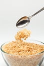 Cane sugar falling from a tea-spoon Royalty Free Stock Photo