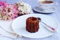 Canele, French confectionery, on a white plate